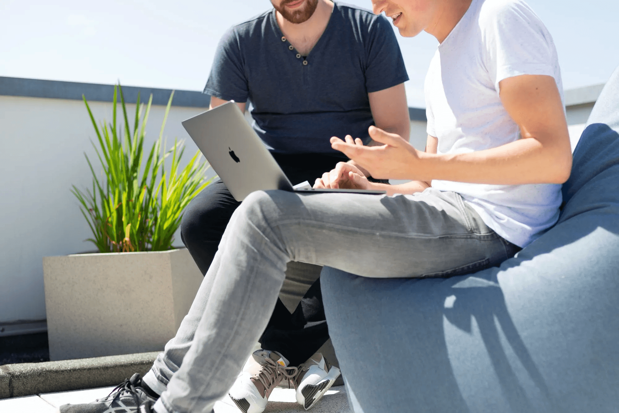 Two young men working on a laptop in Oldenburg, Germany